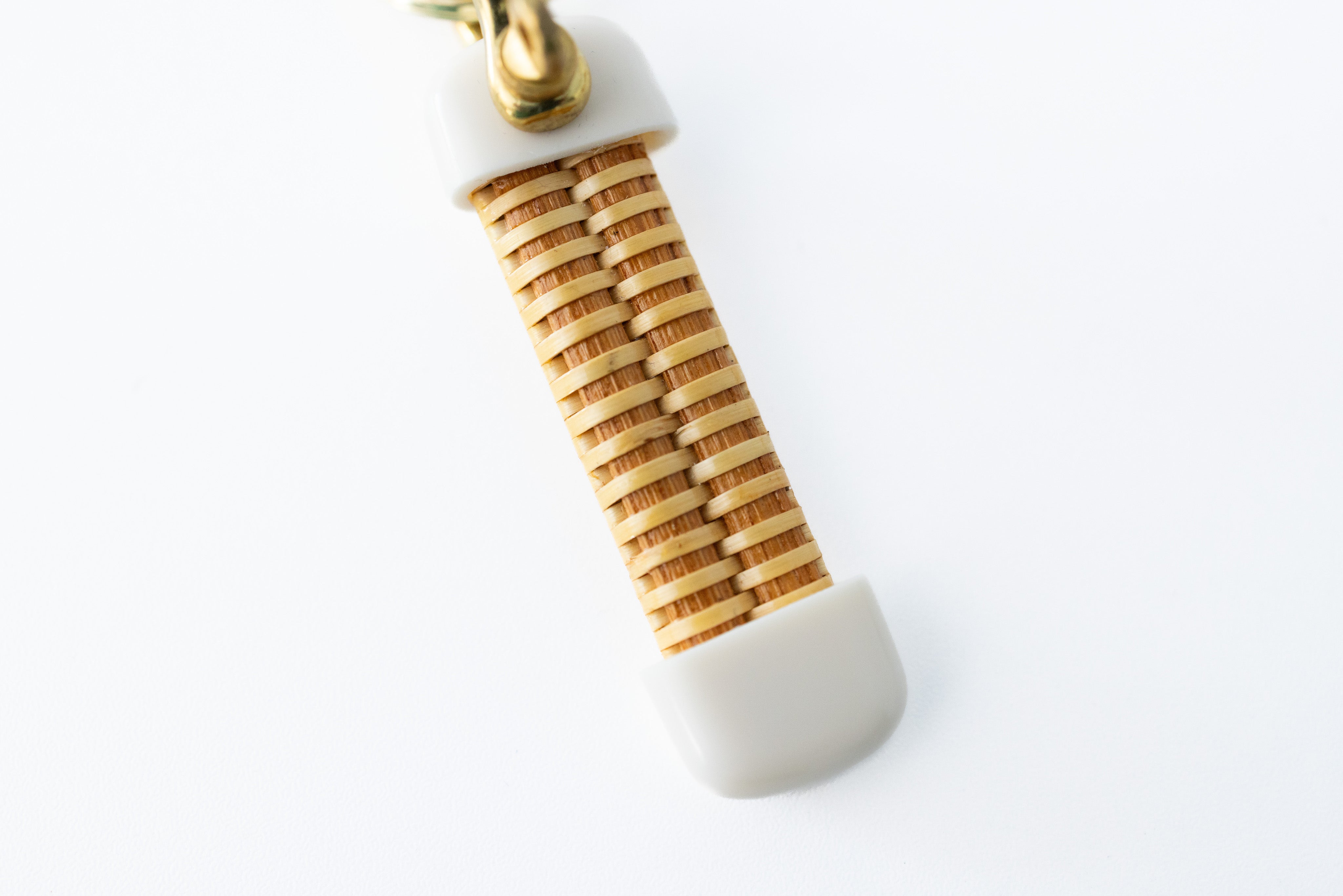 A close up of the handcrafted basket keychain.